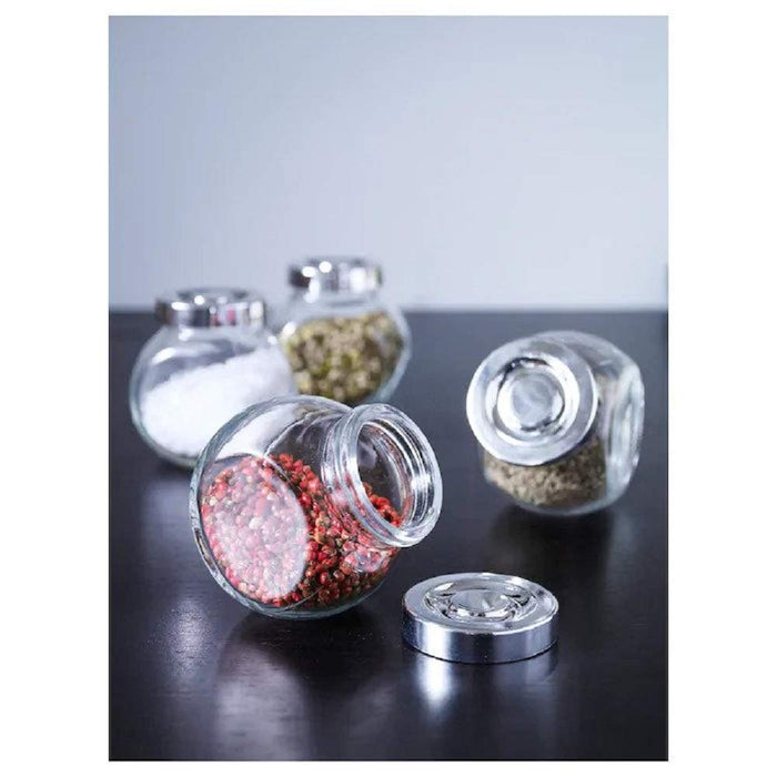 "Organize your kitchen with IKEA's transparent glass jars and lids".