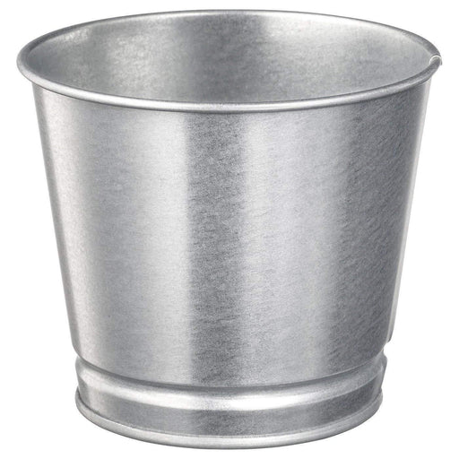 A small, round plant pot in a neutral silver color with a matte finish.