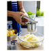  Close-up of the Potato Press in use - "Create perfectly smooth mashed potatoes in minutes with the IKEA Potato Press. 80191915