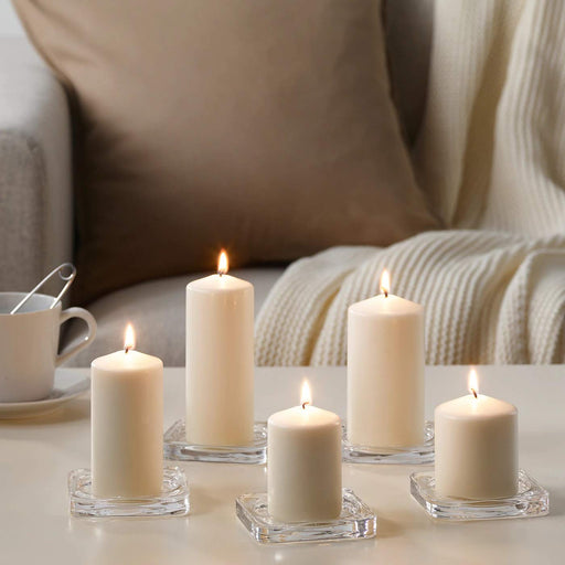 A white unscented block candle from IKEA, featuring a clean and minimalist design that complements any decor style.
