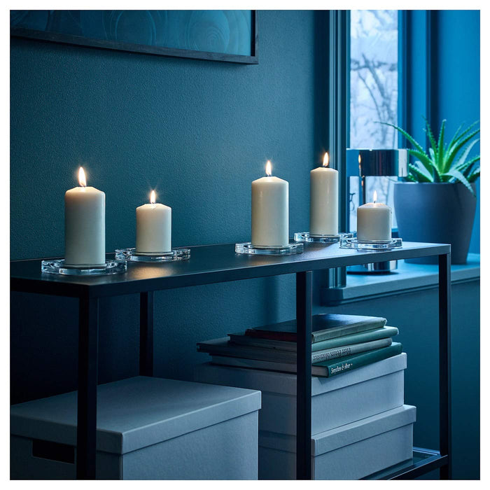An IKEA unscented block candle with a long-lasting burn time, providing natural and soft lighting to any room.