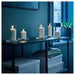 An IKEA unscented block candle with a long-lasting burn time, providing natural and soft lighting to any room.