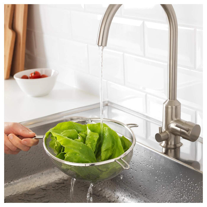 An IKEA strainer with a comfortable grip handle for easy use during food preparation 90165968