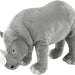 The IKEA Soft Toy Rhino in a playful pose, with its legs bent and its head turned to the side.