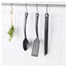  IKEA kitchen utensil set, including a spatula, ladle, serving spoon, slotted spoon, and tongs.