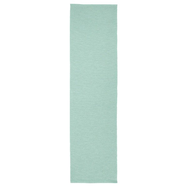 A tasteful table runner that adds a touch of refinement to your dining space.