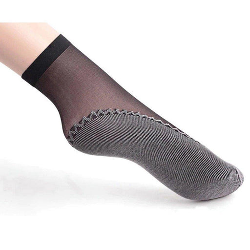 A pair of new design ankle socks for women, with a transparent net material.